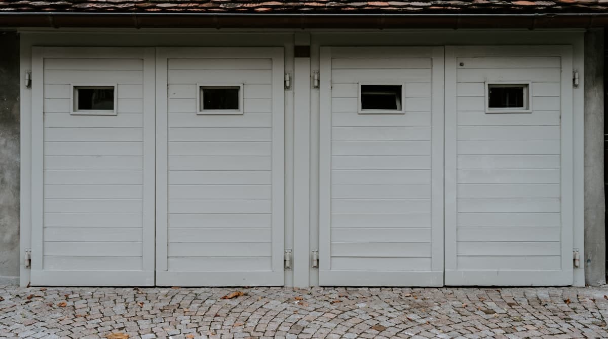 Residential garage door with visible track and spring mechanism